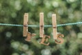 YES word written by hanged wooden letters on rope at garden