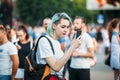 Yessentuki, Stavropol Territory / Russia - August 12, 2017: young woman neformalka with colored blue hair looking at phone
