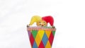 Yester, Narr, clown or man in the box, toy in colorful dress against sky, three in the concept, lower one and upper one