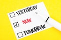 The Yesterday, Now, Tomorrow choice and pen on yellow background Royalty Free Stock Photo