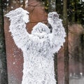 Yeti fairy tale character in winter forest. Outdoor fantasy photo.