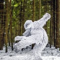 Yeti fairy tale character in winter forest. Outdoor fantasy photo.