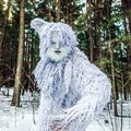 Yeti fairy tale character in winter forest. Outdoor fantasy photo.