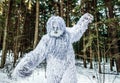 Yeti fairy tale character in winter forest. Outdoor fantasy photo.