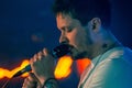 Yevhen Halych singer sing emotional lyrical song on stage of Royal Pub, frontman of O.Torvald rock group