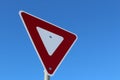 Yield Sign Against Blue Sky Royalty Free Stock Photo