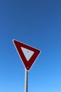 Yield Sign Against Blue Sky Royalty Free Stock Photo