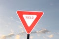 Yield sign and blue sky