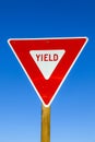 Yield Sign at the highway with blue Royalty Free Stock Photo