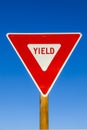 Yield Sign at the highway with blue sky Royalty Free Stock Photo