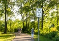 YIELD TO PEDS Sign on the bike and walking path in a wooded area Royalty Free Stock Photo