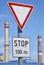 Yield traffic sign and smoke stacks