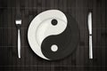 Yin yan plate over bamboo placemat concept Royalty Free Stock Photo