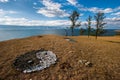 Yin-Yang sign of colored stones on the shore of Lake Baikal. Royalty Free Stock Photo