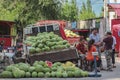 A truckload of watermelons on sale by the street corner