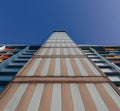 Low angle shot of a colorful striped building in Singapore
