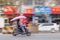 Chinese man on an electric scooter, Yiwu, China