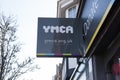 A YMCA sign outside a charity shop in Frinton, Essex in the UK