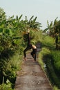 Yoga Bali. Sporty young woman doing yoga asana upward bow wheel pose outdoors in Bali Royalty Free Stock Photo