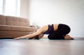 Yoga. beautiful girl is engaged in sports at home, making  stretching. online workout Royalty Free Stock Photo