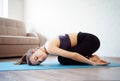 Yoga. beautiful girl is engaged in sports at home, making  stretching. online workout Royalty Free Stock Photo