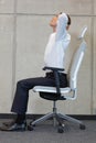 Yoga on chair in office - business man exercising Royalty Free Stock Photo