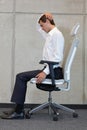 Yoga on chair in office - business man exercising Royalty Free Stock Photo