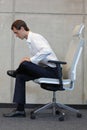 Yoga on chair in office - business man exercising Royalty Free Stock Photo