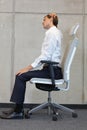 Yoga on chair in office - business man exercising Royalty Free Stock Photo