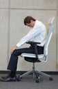 Yoga on chair in office - business man exercising Royalty Free Stock Photo