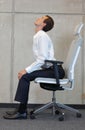 Yoga on chair in office - business man exercising Royalty Free Stock Photo