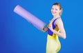 Yoga class concept. Yoga as hobby and sport. Practicing yoga every day. Girl smiling slim fit athlete hold fitness mat Royalty Free Stock Photo