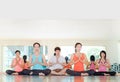 Yoga class in studio room,Group of people doing namaste pose wit Royalty Free Stock Photo