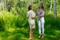 Yoga coach helps a beginner to get on the sadhu board for the first time Royalty Free Stock Photo