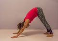 Yoga downward facing dog pose by a young transgender girl Royalty Free Stock Photo