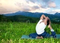 Yoga Eka Pada Rajakapotasana pose in mountains