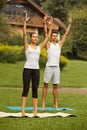 Yoga Exercise. Young couple meditating in fitness club Royalty Free Stock Photo