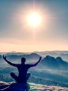 Yoga exervise on mountain summit within amazing morning. Royalty Free Stock Photo