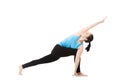 Yoga female in asana parivritta parshvakonasana