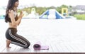 Yoga fitness lifestyle healthy woman relaxation doing a meditation. Yoga meditating outdoor with zen on lotus sitting position. Royalty Free Stock Photo