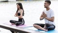 Yoga fitness lifestyle healthy woman relaxation doing a meditation. Yoga meditating outdoor with zen on lotus sitting position. Royalty Free Stock Photo