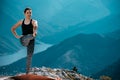 Outdoor shot of woman doing yoga exercise at the hill Royalty Free Stock Photo