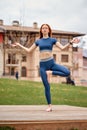 Yoga and fitness. Young redhead woman practicing morning meditation outdoors Royalty Free Stock Photo
