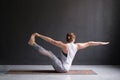 Yoga girl doing parivrtta navasana or twisted boat pose Royalty Free Stock Photo