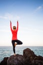 Yoga girl meditating in vrksasana tree pose Royalty Free Stock Photo