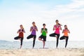 Yoga group of people doing tree pose and namaste with calm relax Royalty Free Stock Photo