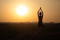 Yoga in Hampi temple, copyspase at sunset. lady with stylish jumpsuit Royalty Free Stock Photo