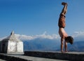 Yoga in Himalays. Handstand.