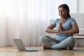 Yoga At Home. Calm Black Lady Meditating In Front Of Laptop