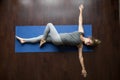 Yoga at home: Jathara Parivartanasana Pose Royalty Free Stock Photo